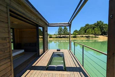 Ferienhaus an einem privaten Teich mit Blick ...