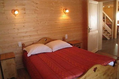 A large and magnificent wooden chalet with a...