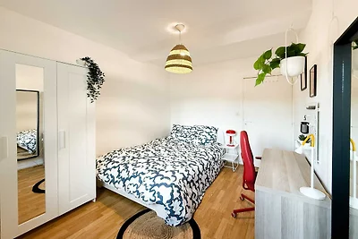 Camera accogliente in un accogliente appartam...