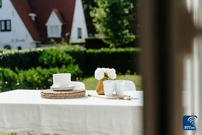 Wohnung in De Haan mit Garten