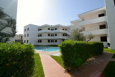 Appartamento Cala Montgo con piscina