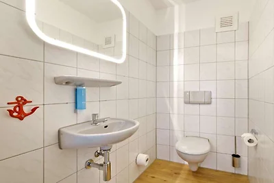 Zalmvissers in hun huisje aan de Rijn