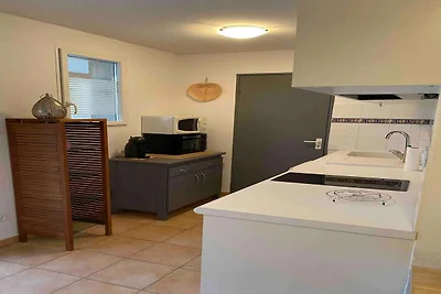 Appartement aan het strand met zwembad