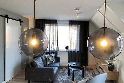 Lodge mit Blick auf die Kirche und die Dünen