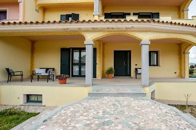 Ferienhaus in Telti mit Terrasse