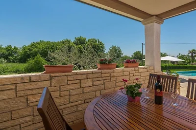 Holiday home in Tinjan with swimming pool