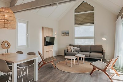 Moderne Lodge mit IR-Sauna, 500m vom Strand