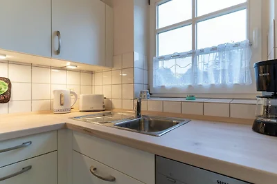 Apartment mit Kamin in einer reetgedeckten...