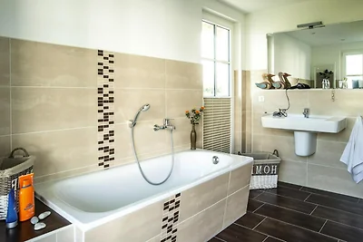 Casa con tetto di paglia sul Bodden con sauna