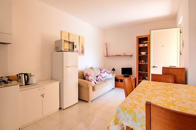 Apartment mit Terrasse und Sonnenliegen