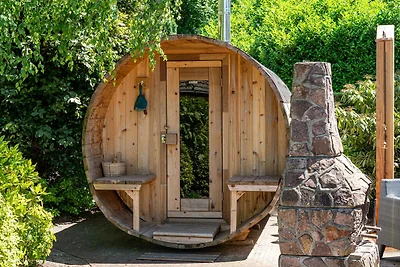 Cosy forest cabin with a barrel sauna