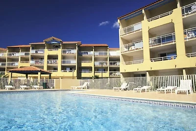 Appartement aan het strand met zwembad