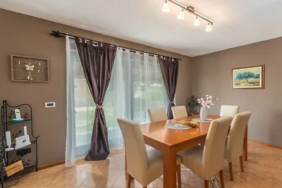 Holiday home in Tinjan with swimming pool