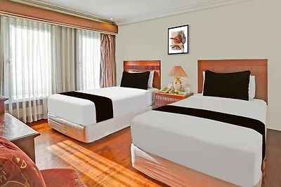 Dormitorio misto economico con atmosfera