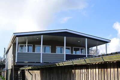 Modern lodge with an electric sloop in centre...
