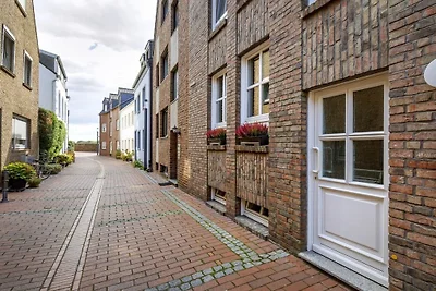Zalmvissers in hun huisje aan de Rijn