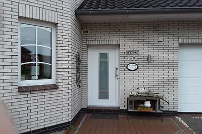 A in het huis in de rozentuin