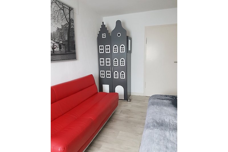 Slaapkamer Amsterdam met kinderbed en slaapbank