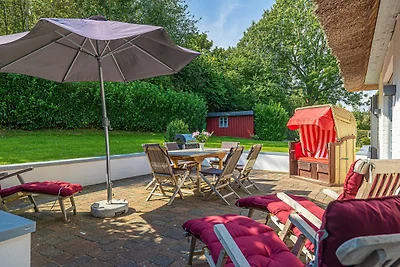 Weisse Reetdachkate Wohnung 1