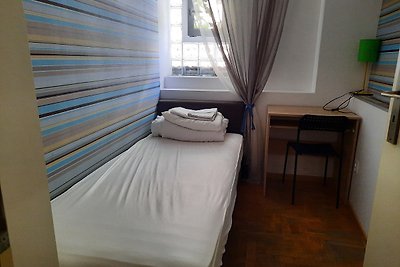 Single room with shared bathroom