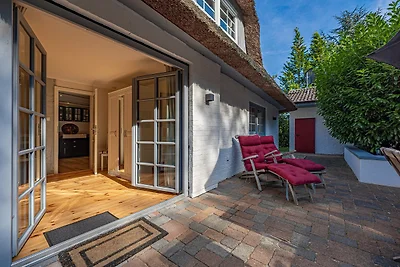 Weisse Reetdachkate Wohnung 1