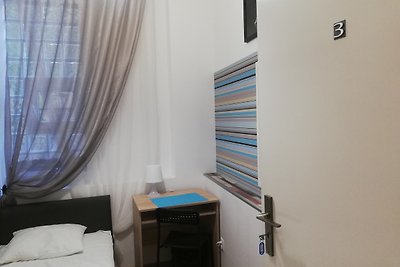 Single room with shared bathroom