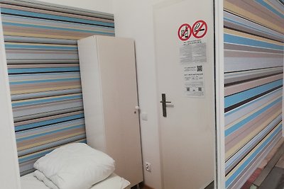 Single room with shared bathroom