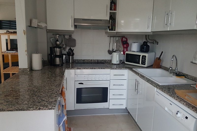 Fully equiped kitchen with oven, dishwasher, washing machine, dry tumbler, coffeemaker, microwave, toaster, ...
