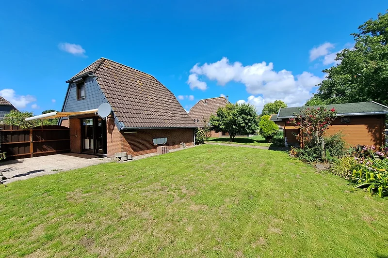 Ferienhaus Zonneschijn verfügt über einen großen und grünen Garten mit viel Platz zum Spielen, Sonnenbaden und Entspanne