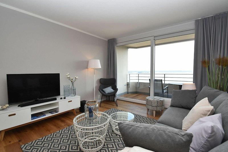 spacious, bright living area with access to the balcony