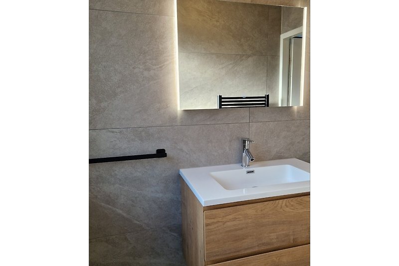 Luxury bathroom with heated mirror