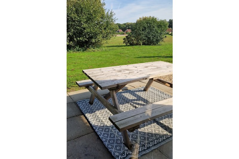 Enjoy the very spacious outdoor area on your own picnic bench overlooking the swimming lake