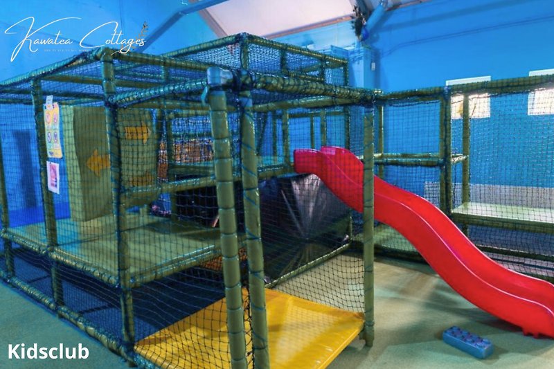 Indoor playground with slide and play equipment