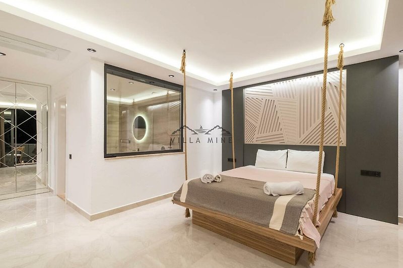 Modernes Schlafzimmer mit stilvoller Einrichtung und gemütlichem Bett. Ideal zum Entspannen!