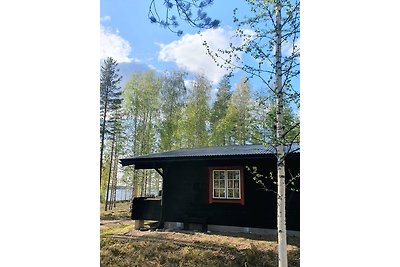 Cabina di legno sul lago Kesjön