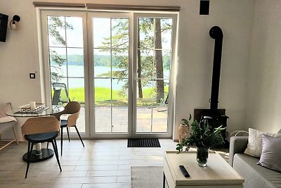 JW MAZURY Ferienhaus Żuraw mit Steg