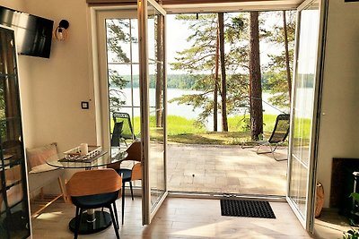 JW MAZURY Ferienhaus Żuraw mit Steg