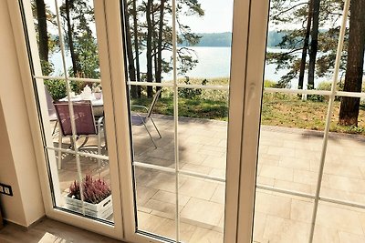 JW MAZURY Ferienhaus Żuraw mit Steg