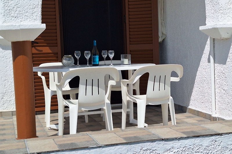 Rent this charming property with stylish furniture, a cozy outdoor table, and a beautiful terrace.