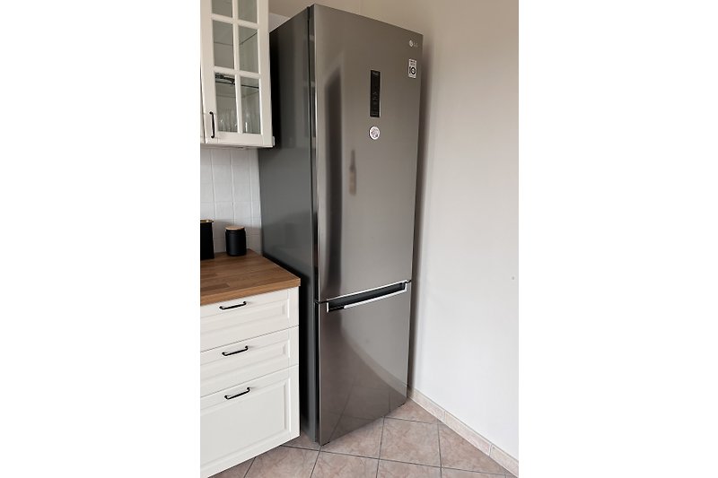 A large family fridge will perfectly  keep  all your groceries and beverages .