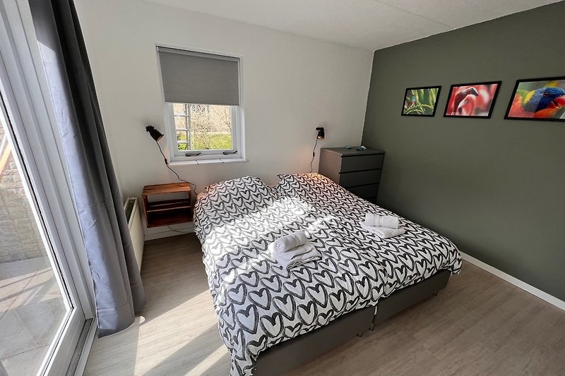 Ground floor comfortable bedroom with stylish interior design and cozy bed.