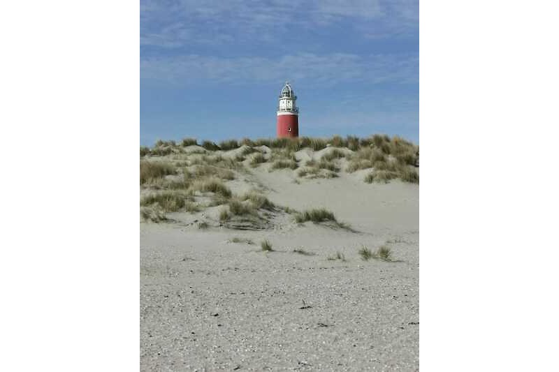 Faszinierender Leuchtturm mit atemberaubender Küstenlandschaft und weitem Horizont auf Texel