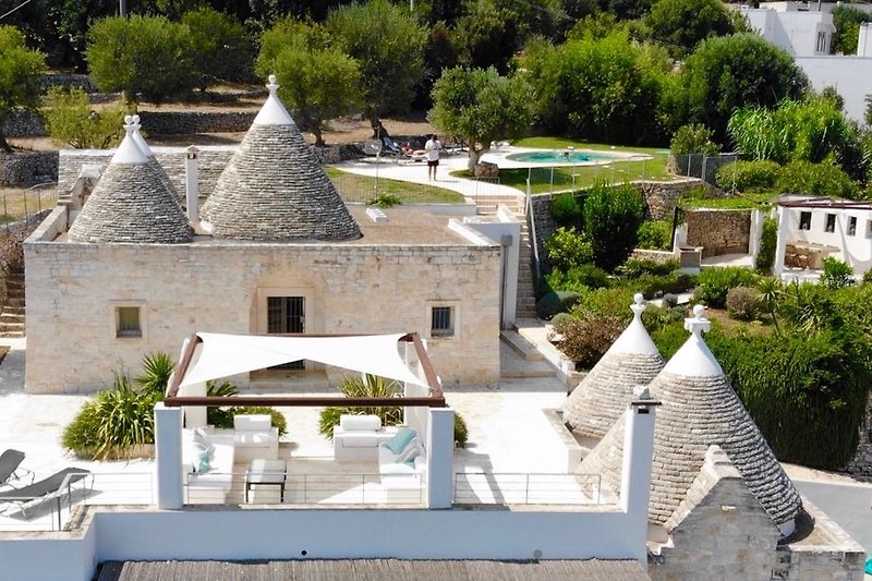 Experience a historic Trullo with a picturesque garden and stunning landscaping.