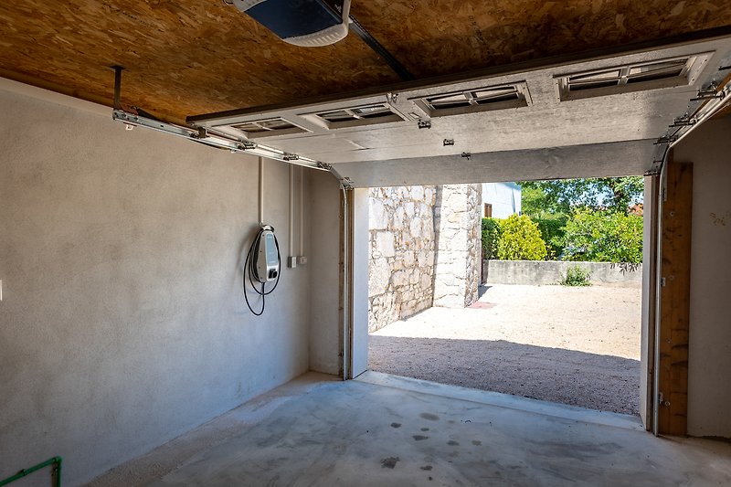 Closed garage with an electric car charger