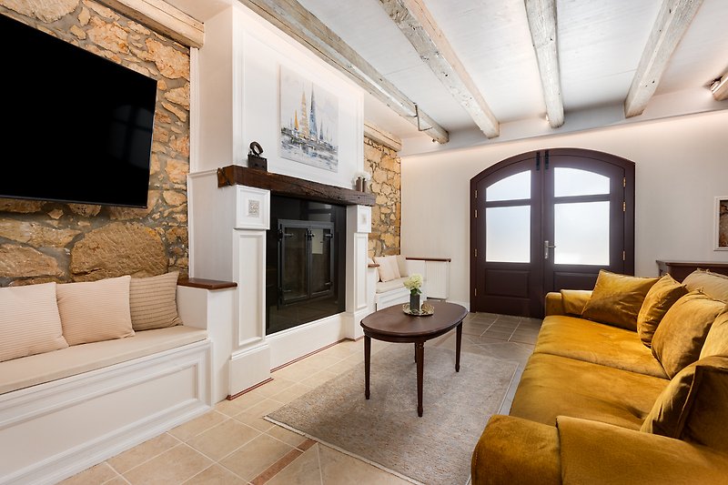 The living room features a beautiful fireplace as one of its prominent focal points.