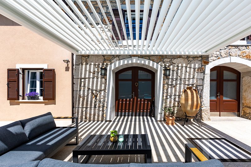 Enjoying a terrace under a bioclimatic pergola is a delightful experience.