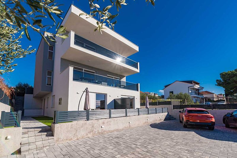 Modern urban property with a stylish design and parking area.