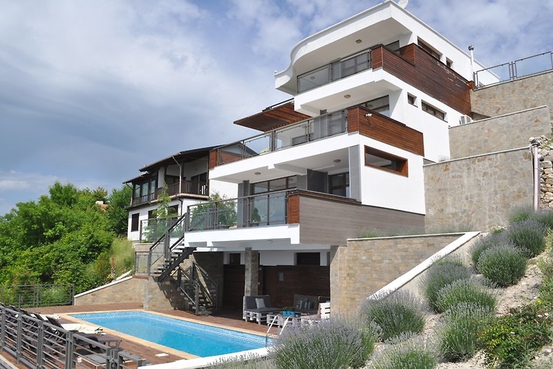 Side view of Villa Jazzy with a private pool and stunning architecture.