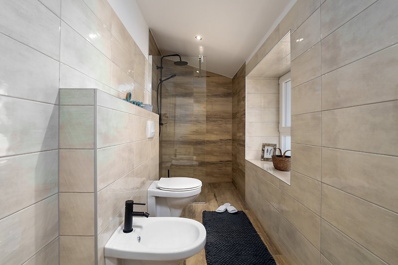 A beautifully designed bathroom with stylish fixtures and elegant lighting.