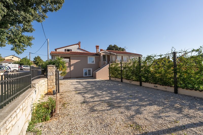 A charming house with a beautiful garden, surrounded by nature and a peaceful residential area.